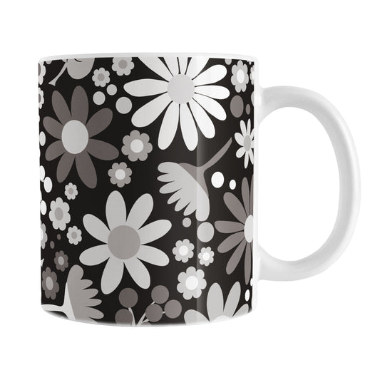 Mug with a floral pattern featuring white and gray flowers on a black background