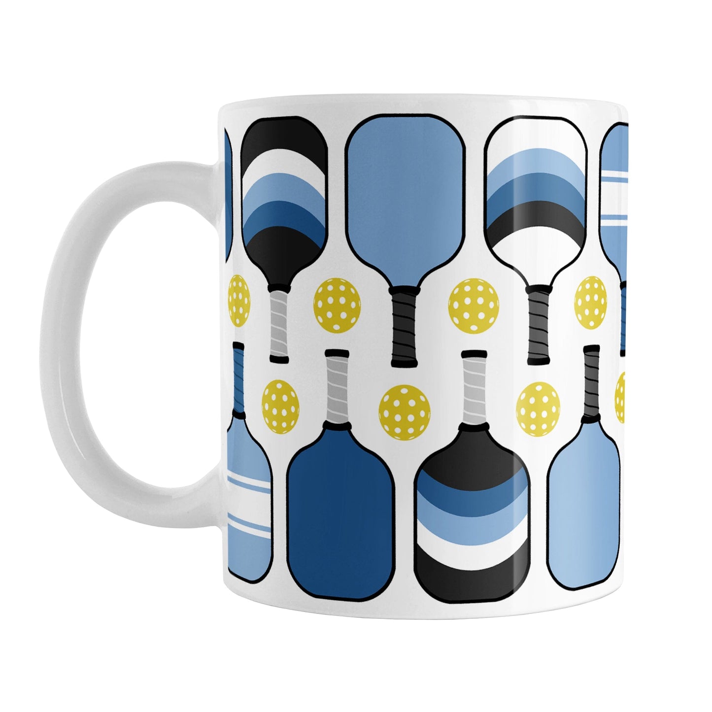 Blue Pickleball Mug (11oz) at Amy's Coffee Mugs. A ceramic coffee mug designed with modern blue pickleball paddles and yellow balls in a pattern that wraps around the mug up to the handle.