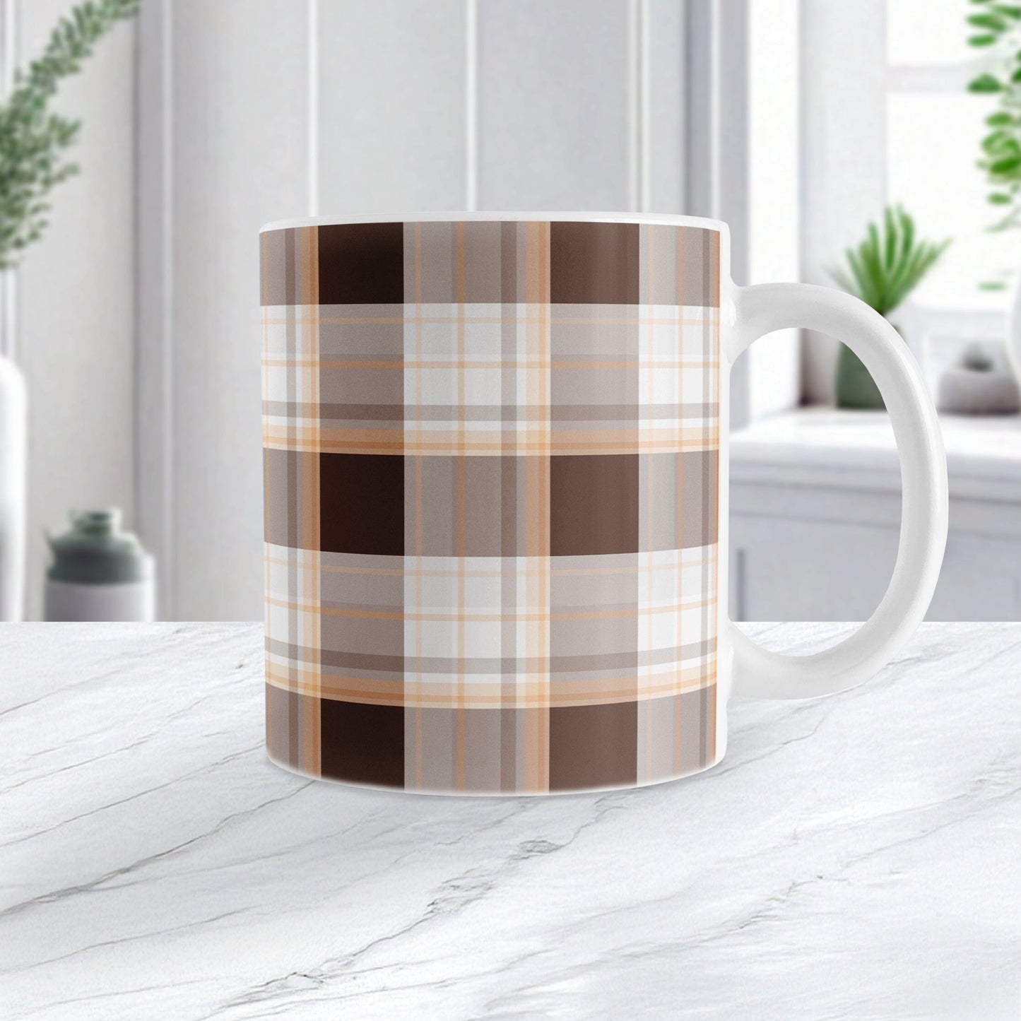 11 oz brown orange plaid mug with dark brown, light brown, white, and warm orange layered plaid pattern, on a marble countertop in a white kitchen.