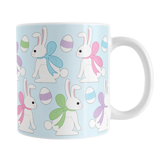 11oz mug with Easter-themed design featuring bunnies and eggs on a light blue background