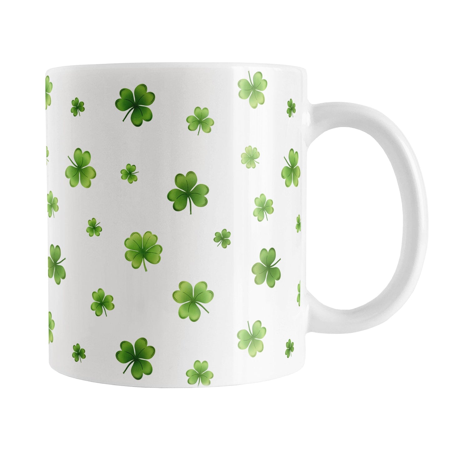 Dainty Shamrocks and Clovers Mug (11oz) at Amy's Coffee Mugs. A ceramic coffee mug designed with hand-drawn green shamrocks and 4-leaf clovers in a dainty minimalist pattern that wraps around the mug up to the handle.