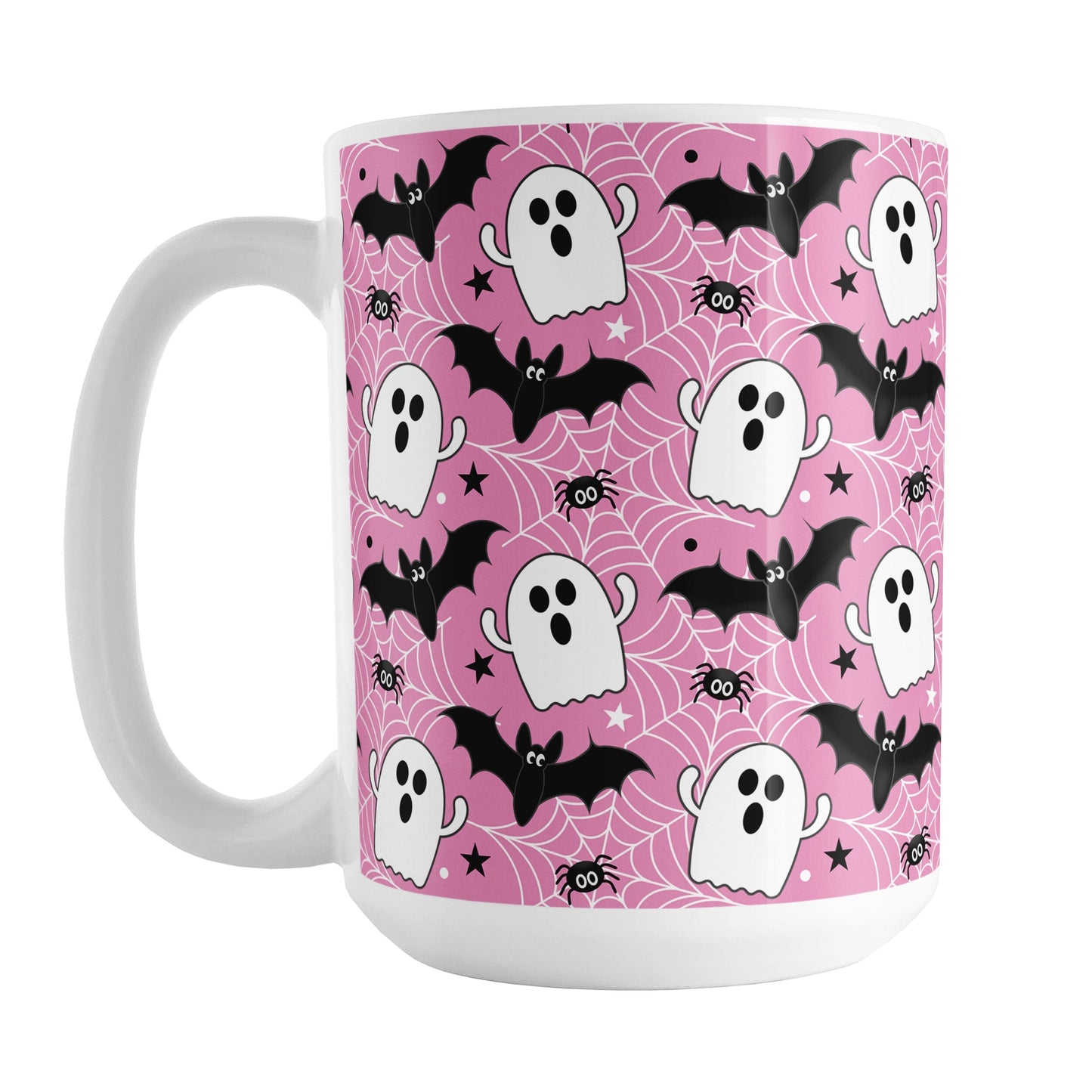 Mug with Halloween-themed design featuring ghosts, bats, and spiders on a pink background