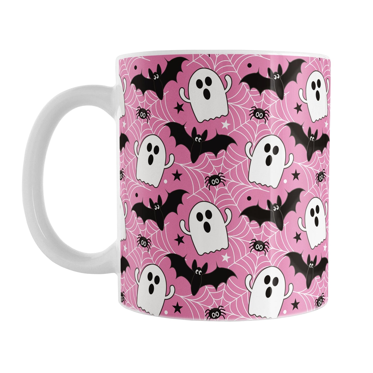 Pink mug with Halloween-themed design featuring ghosts, bats, and spider webs