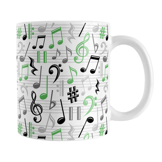 Green Music Notes Pattern Mug (11oz) at Amy's Coffee Mugs. A ceramic coffee mug designed with music notes and symbols in green, black, and gray in a pattern that wraps around the mug to the handle.