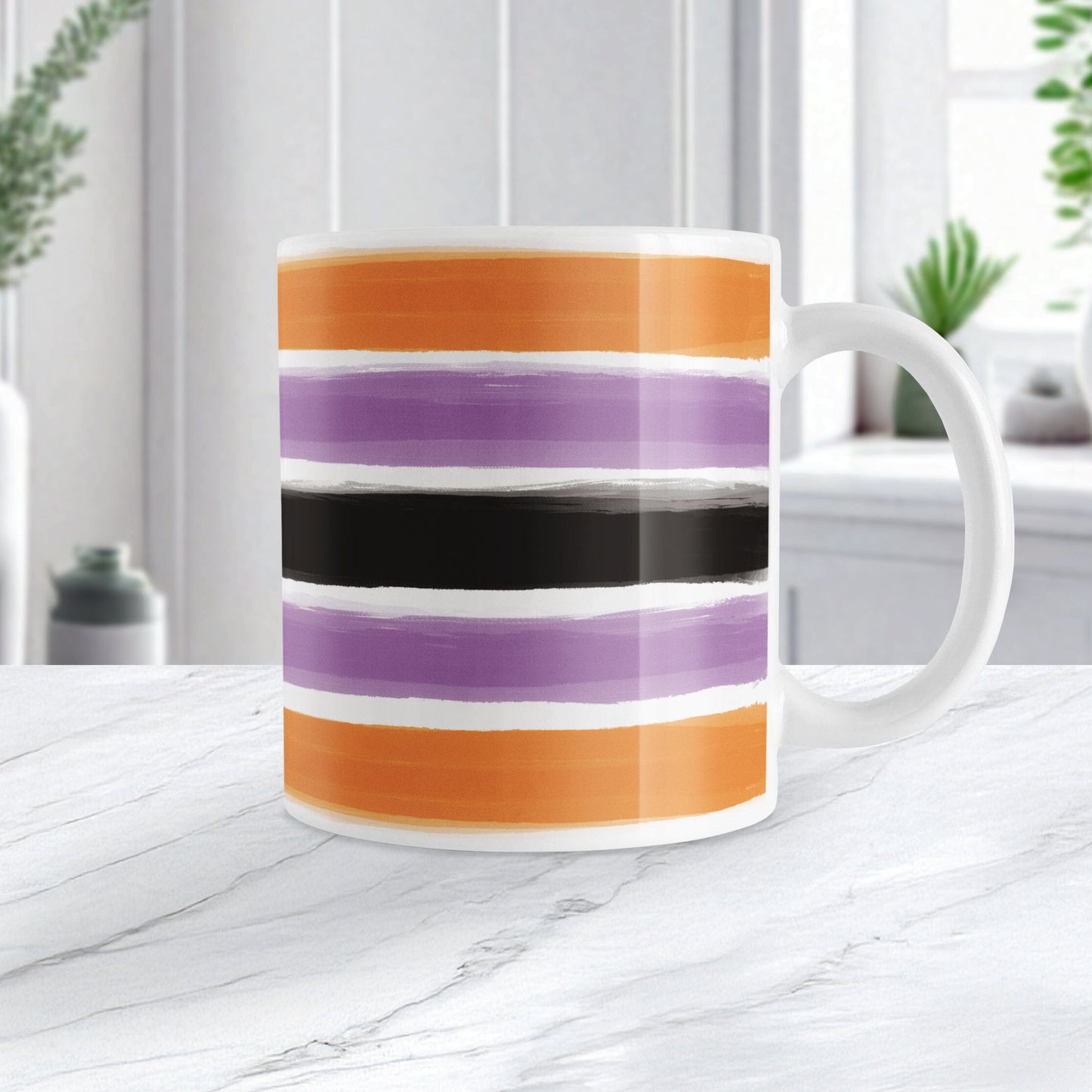 Mug with colorful Halloween-inspired stripes on a marble surface with a blurred indoor background