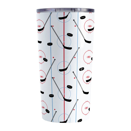 Hockey Rink Pattern Tumbler Cup (20oz) at Amy's Coffee Mugs. A stainless steel tumbler cup designed with hockey rink red and blue lines, coupled with hockey sticks and hockey pucks, a pattern that wraps around the cup.