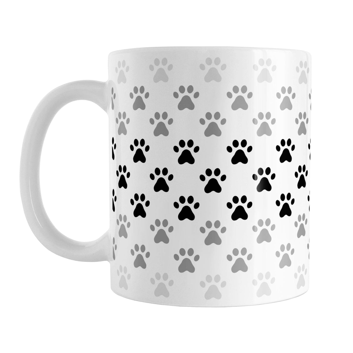Paw Prints in Black Mug (11oz) at Amy's Coffee Mugs. A ceramic coffee mug designed with paw prints in different shades of black and gray, with black across the middle and a lighter gray along the top and bottom, in a pattern that wraps around the mug to the handle.