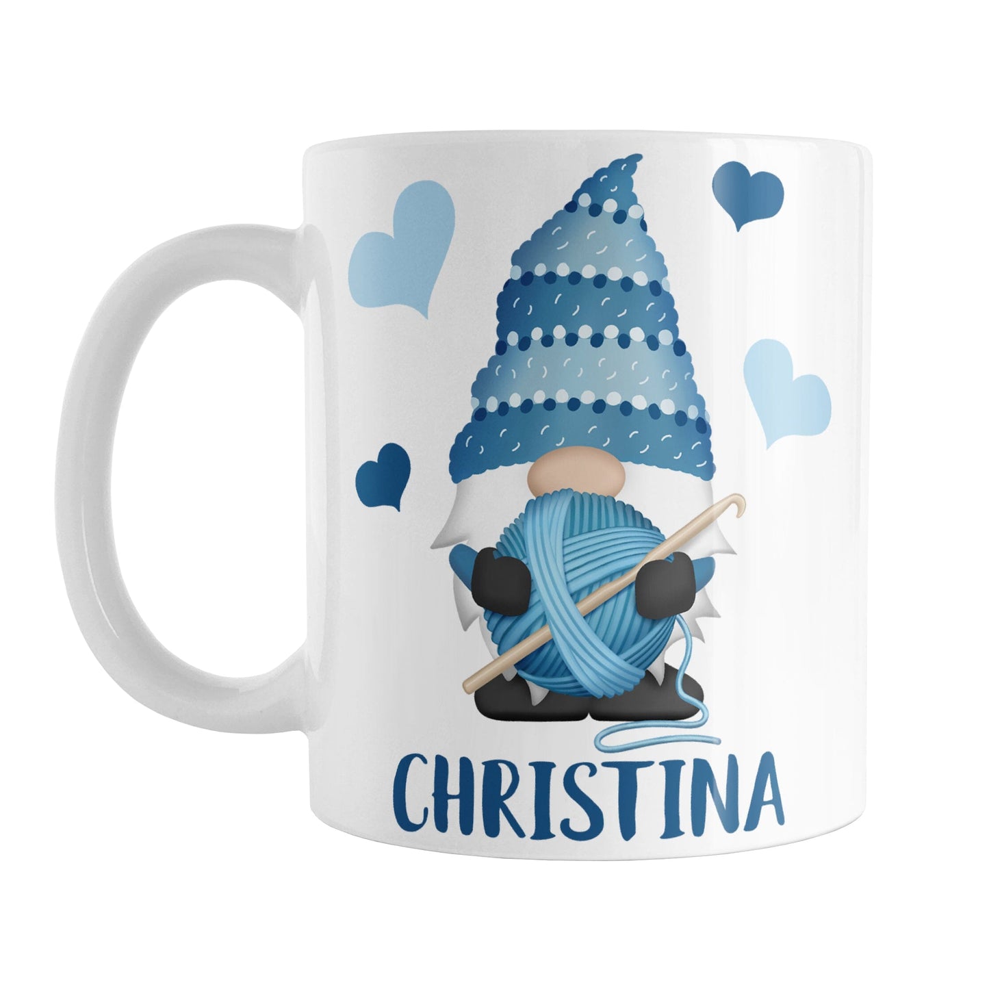 Personalized Blue Crochet Gnome Mug (11oz) at Amy's Coffee Mugs. A ceramic coffee mug designed with a cute gnome wearing a blue crochet hat while holding a ball of blue yarn and a crochet hook with blue hearts around him. Your name is printed in a fun blue font below the gnome. This adorable illustration and personalization is on both sides of the mug.