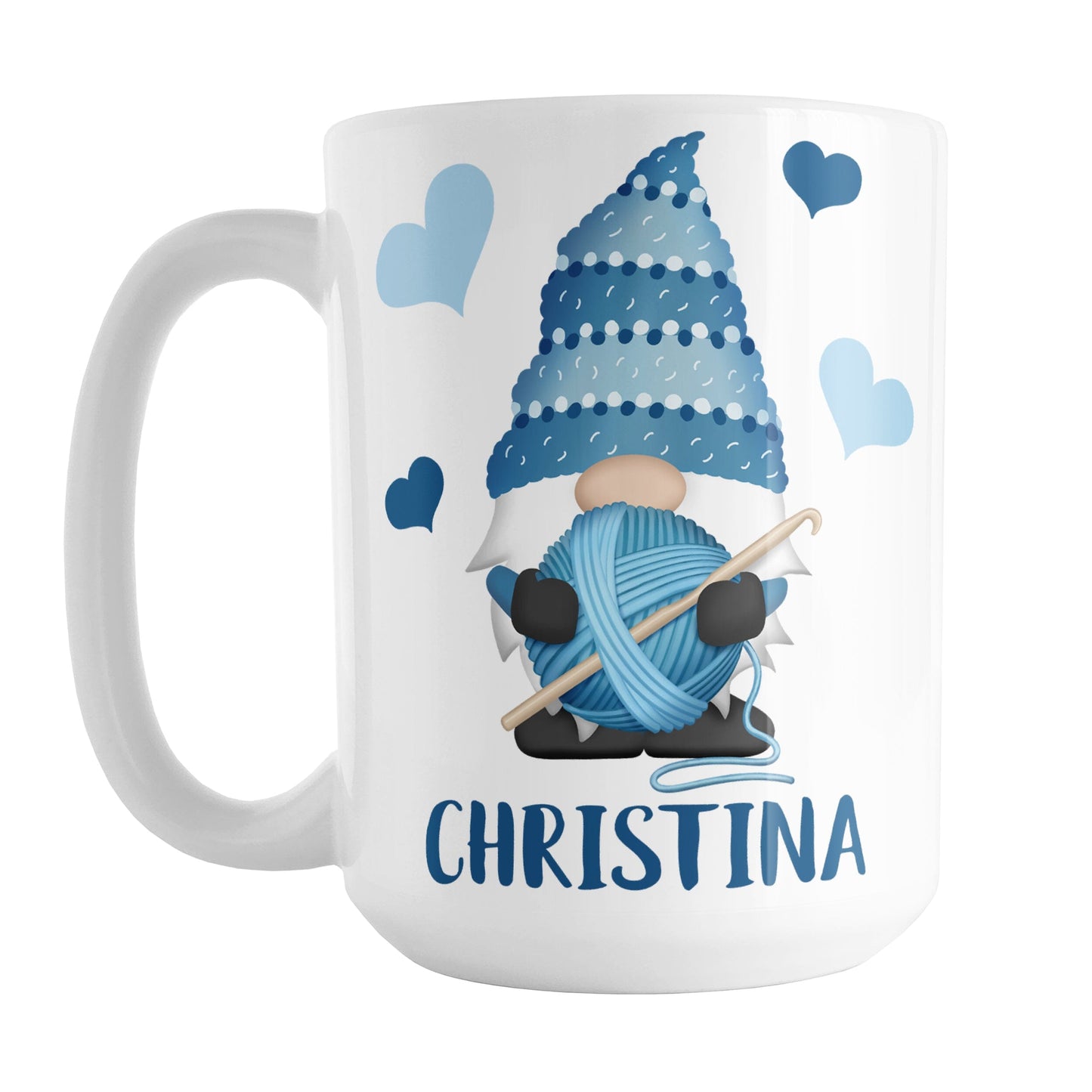 Personalized Blue Crochet Gnome Mug (15oz) at Amy's Coffee Mugs. A ceramic coffee mug designed with a cute gnome wearing a blue crochet hat while holding a ball of blue yarn and a crochet hook with blue hearts around him. Your name is printed in a fun blue font below the gnome. This adorable illustration and personalization is on both sides of the mug.