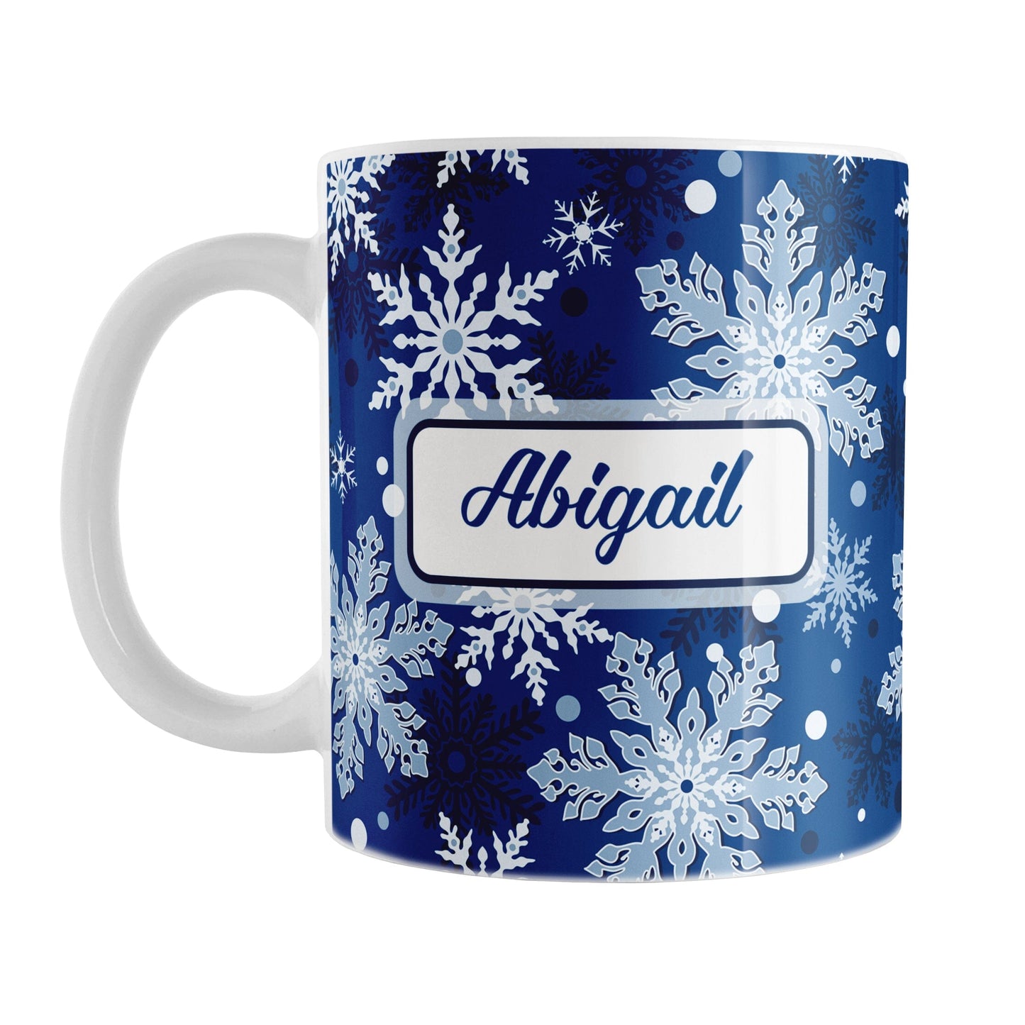 Personalized Classic Blue Snowflake Winter Mug (11oz) at Amy's Coffee Mugs. A ceramic coffee mug designed with a pattern of different shades of blue snowflakes over a classic blue background color that wraps around the mug to the handle. Your name is custom printed in a blue script font on both sides of the mug.