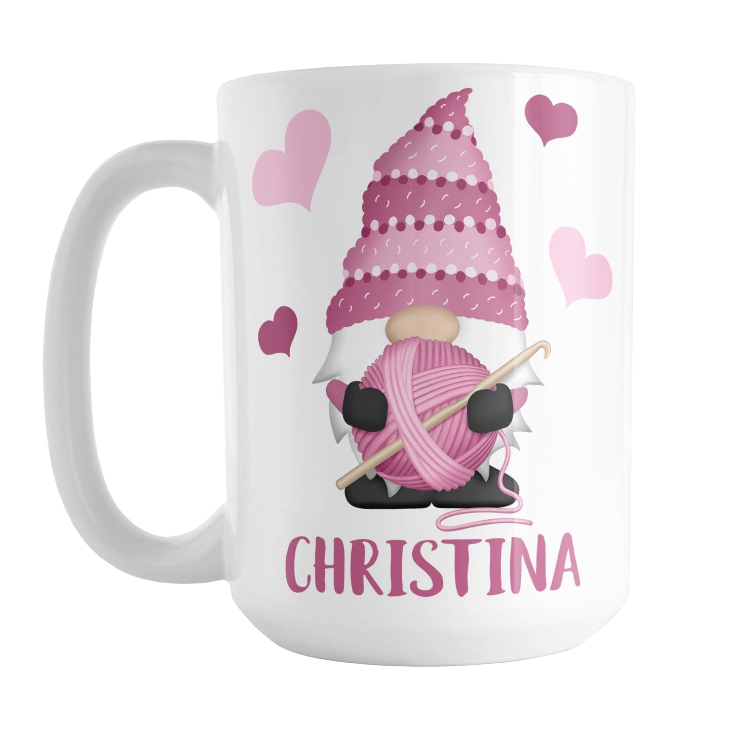 Personalized Pink Crochet Gnome Mug (15oz) at Amy's Coffee Mugs. A ceramic coffee mug designed with a cute gnome wearing a pink crochet hat while holding a ball of pink yarn and a crochet hook with pink hearts around him. Your name is printed in a fun pink font below the gnome. This adorable illustration and personalization is on both sides of the mug.