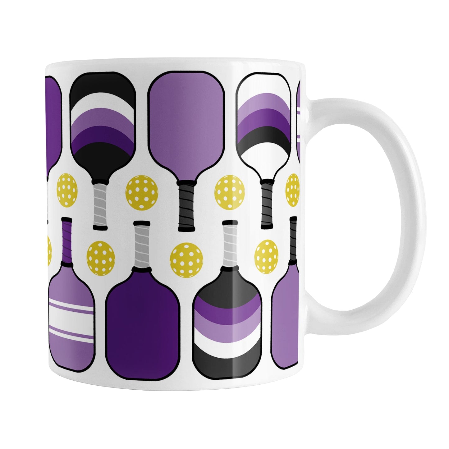 Purple Pickleball Mug (11oz) at Amy's Coffee Mugs. A ceramic coffee mug designed with modern purple pickleball paddles and yellow balls in a pattern that wraps around the mug up to the handle.