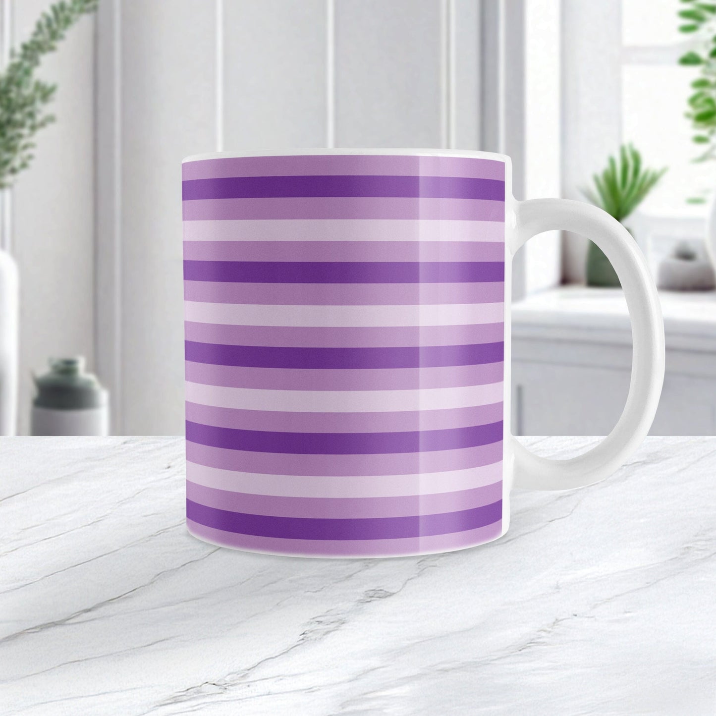 11oz white mug with horizontal purple stripes in 3 shades of purple in a pattern that wraps around the mug up to the handle, on a marble countertop