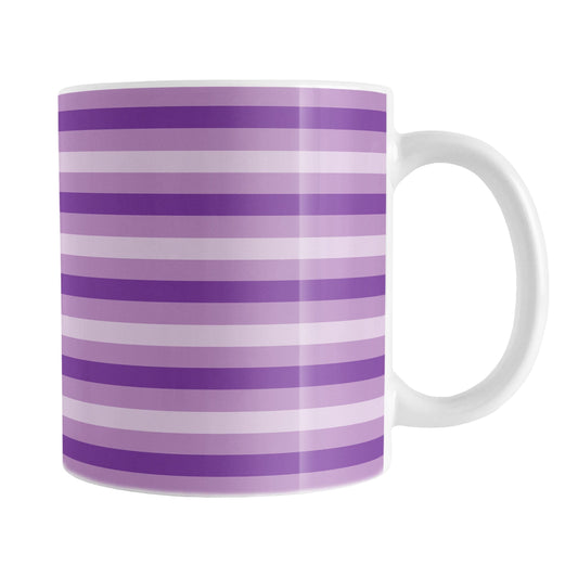 11oz white mug with horizontal purple stripes in 3 shades of purple in a pattern that wraps around the mug up to the handle