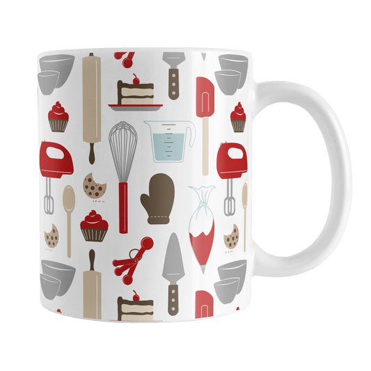 Red Baking Pattern Mug (11oz) at Amy's Coffee Mugs. A ceramic coffee mug designed with a pattern of baking tools like spatulas, whisks, mixers, bowls, and spoons, with cookies, cupcakes, and cake all in a red, gray, brown, and beige color scheme that wraps around the mug.
