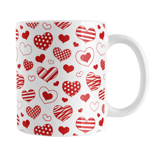 Red Heart Doodles Mug (11oz) at Amy's Coffee Mugs. A ceramic coffee mug designed with hand-drawn red heart doodles in a pattern that wraps around the mug up to the handle. This cute hearts pattern is perfect for Valentine's Day or for anyone who loves hearts and young-at-heart drawings.