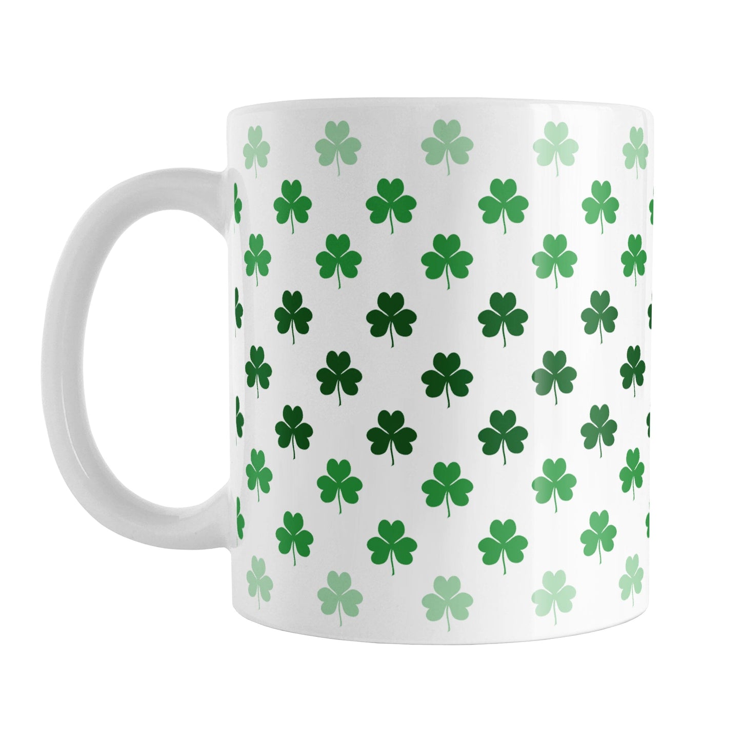 Shamrocks in Green Mug (11oz) at Amy's Coffee Mugs. A ceramic coffee mug designed with shamrocks (or clovers) in different shades of green, with the darker green color across the middle and the lighter green along the top and bottom, in a pattern that wraps around the mug to the handle.