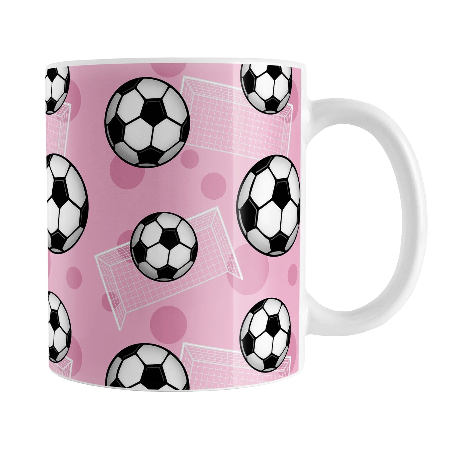 Soccer Ball and Goal Pattern Pink Mug (11oz) at Amy's Coffee Mugs. A ceramic coffee mug designed with a pattern of soccer balls and white soccer goals over a pink background with pink circles.