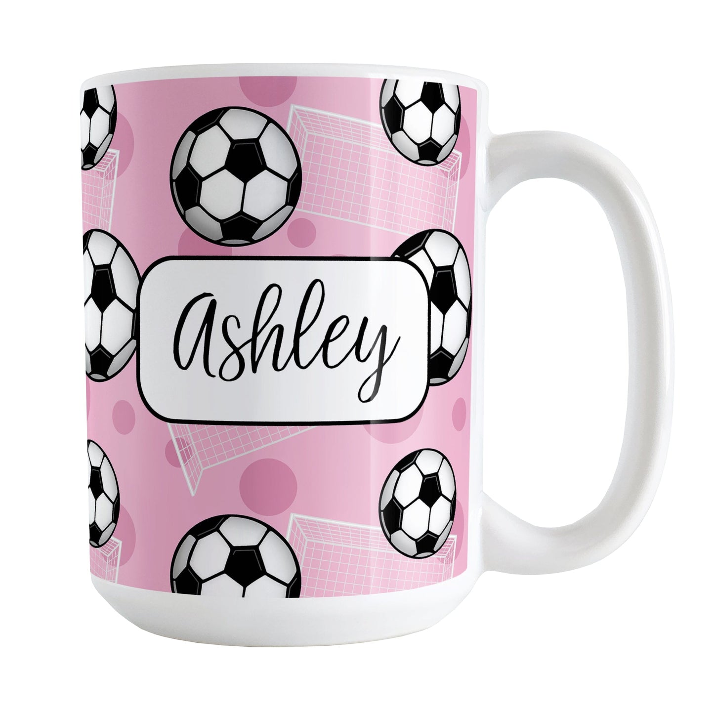Soccer Ball and Goal Personalized Pink Soccer Mug (15oz) at Amy's Coffee Mugs. A ceramic coffee mug designed with a pattern of soccer balls and white soccer goals over a pink background with pink circles. Your personalized name is custom-printed in a fun black script font on both sides of the mug over the soccer pattern.