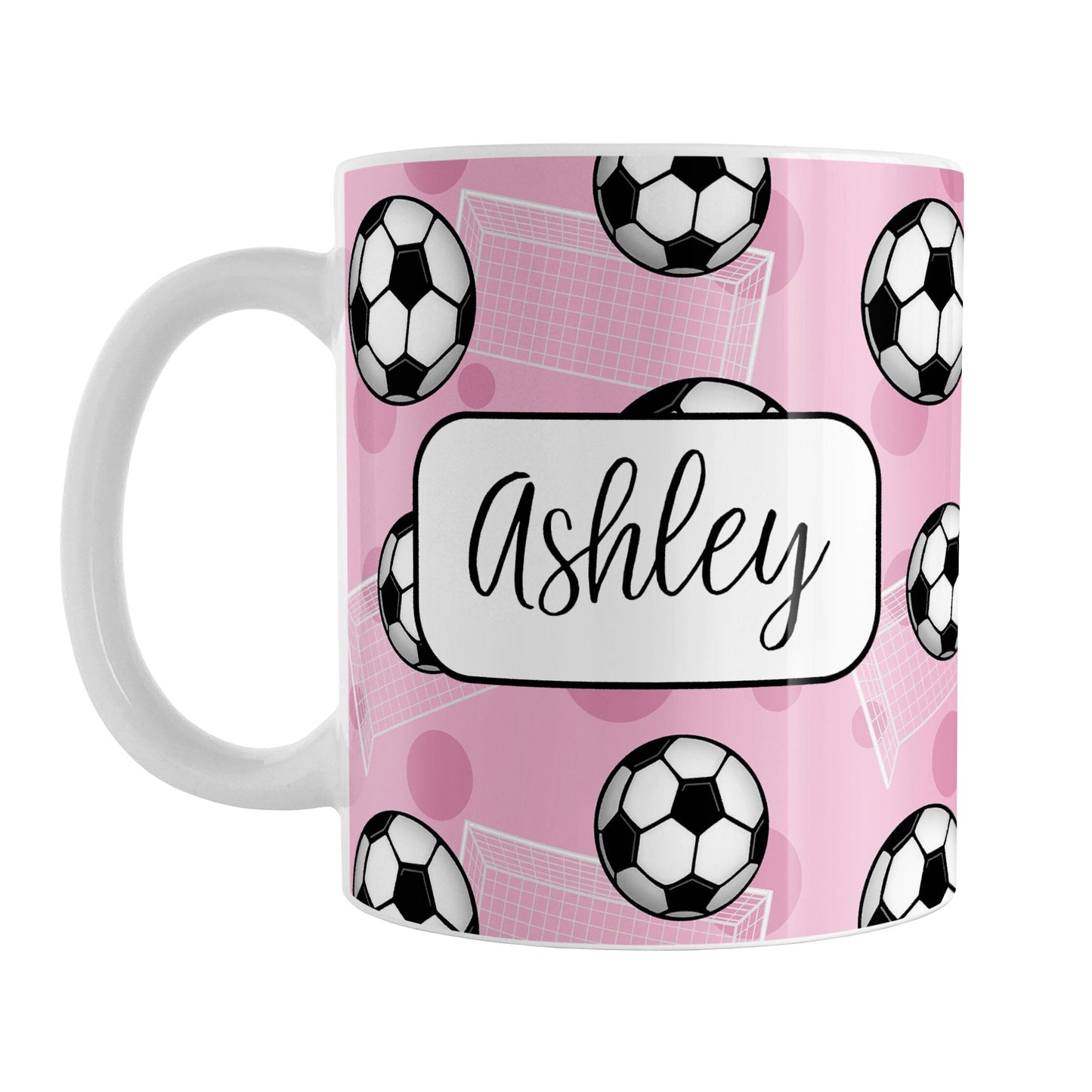 Soccer Ball and Goal Personalized Pink Soccer Mug (11oz) at Amy's Coffee Mugs. A ceramic coffee mug designed with a pattern of soccer balls and white soccer goals over a pink background with pink circles. Your personalized name is custom-printed in a fun black script font on both sides of the mug over the soccer pattern.