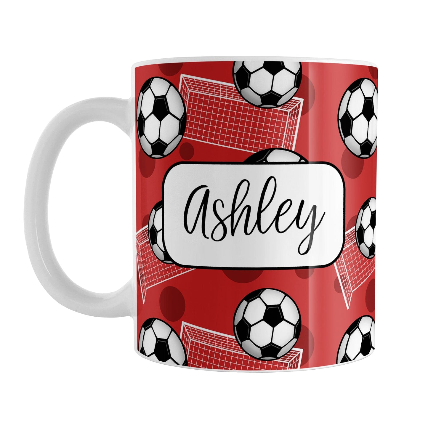 Soccer Ball and Goal Personalized Red Soccer Mug (11oz) at Amy's Coffee Mugs. A ceramic coffee mug designed with a pattern of soccer balls and white soccer goals over a red background with red circles. Your personalized name is custom-printed in a fun black script font on both sides of the mug over the soccer pattern.