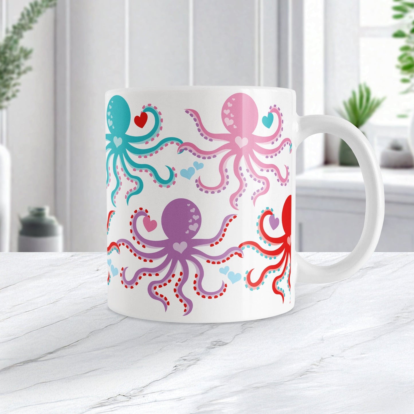 11oz white mug with a colorful octopus pattern with hearts, perfect for Valentine's Day, sitting on a marble countertop