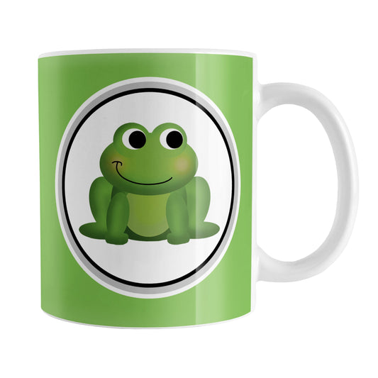 Adorable Green Frog Mug (11oz) at Amy's Coffee Mugs. A ceramic coffee mug designed with a cute and happy green frog in a white circle on both sides of the mug over a green background color that wraps around the mug up to the handle.
