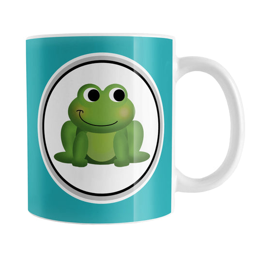 Adorable Turquoise Frog Mug (11oz) at Amy's Coffee Mugs. A ceramic coffee mug designed with a cute and happy green frog in a white circle on both sides of the mug over a turquoise background color that wraps around the mug up to the handle.