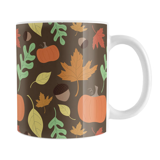 Autumn Pumpkins and Leaves Pattern - Fall Mug (11oz) at Amy's Coffee Mugs. A ceramic coffee mug designed with a pattern of pumpkins, acorns, and leaves in orange, yellow, and green over a brown background color that wraps around the mug up to the handle.