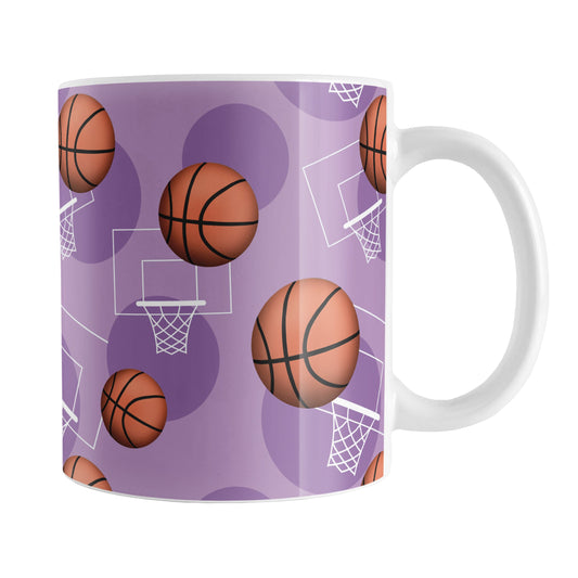 Purple Basketball Pattern Mug (11oz) at Amy's Coffee Mugs. A ceramic coffee mug designed with a sports themed pattern with basketballs and white hoops/nets over a purple colored background that wraps around the mug up to the handle.