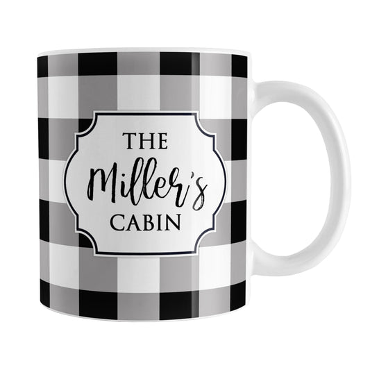 Black and White Personalized Buffalo Plaid Mug (11oz) at Amy's Coffee Mugs. A ceramic coffee mug designed with a black and white buffalo plaid (buffalo check) pattern that wraps around the mug up to the handle, and your personalization is done in a white frame design on both sides of the mug over the buffalo plaid background.