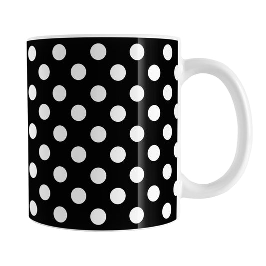 Black Polka Dot Mug (11oz) at Amy's Coffee Mugs. A ceramic coffee mug designed with a pattern of white polka dots over a black background color that wraps around the mug up to the handle.