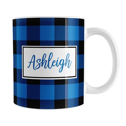 Blue and Black Personalized Name Buffalo Plaid Mug (11oz) at Amy's Coffee Mugs. A ceramic coffee mug designed with a blue and black buffalo plaid (buffalo check) pattern that wraps around the mug up to the handle. Your personalized name is custom printed in a blue script font in a white rectangle design on both sides of the mug.