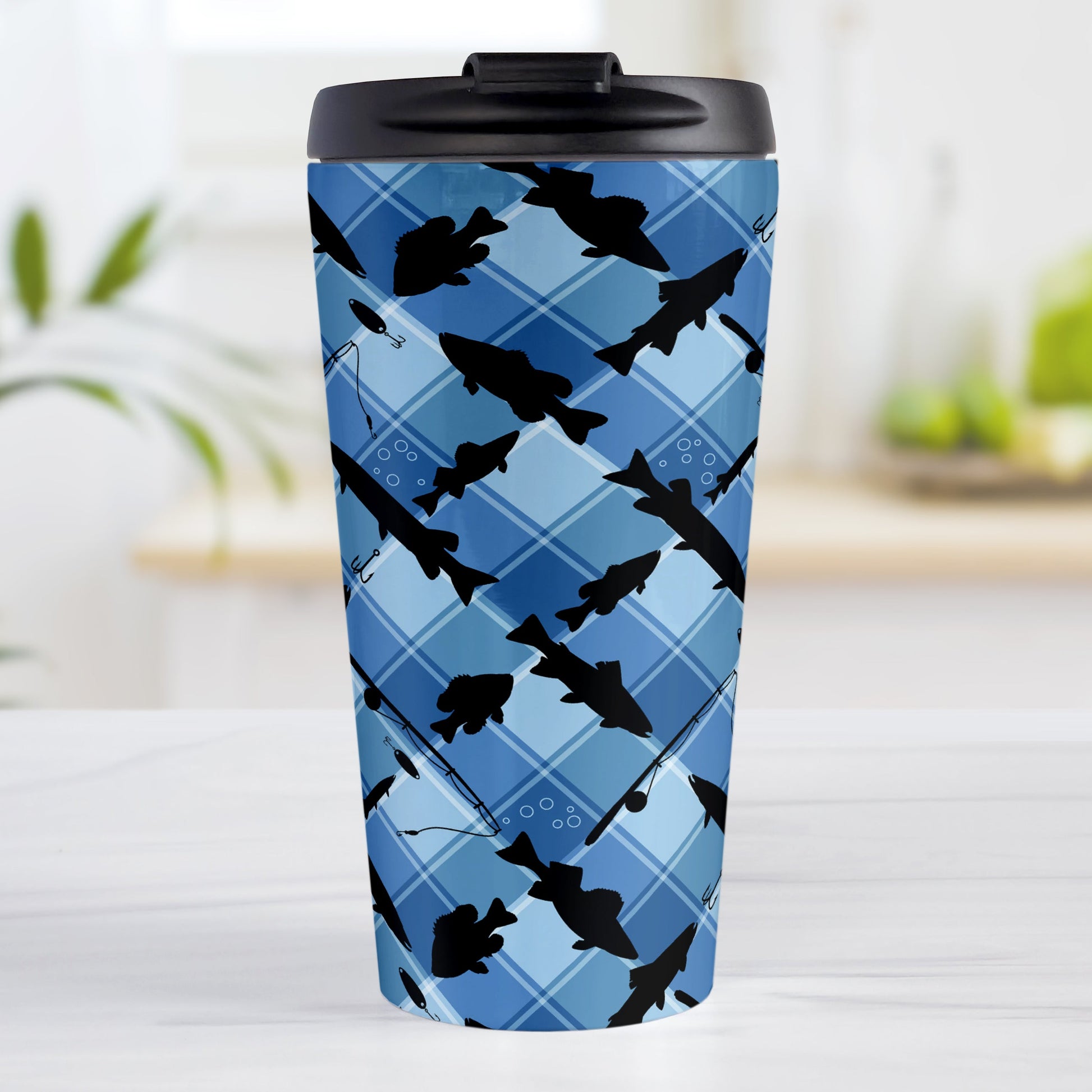 Blue Fishing Plaid Pattern Travel Mug (15oz) at Amy's Coffee Mugs. A travel mug designed with black silhouettes of fish, fishing poles, and lures diagonally arranged over a blue plaid pattern that wraps around the travel mug.
