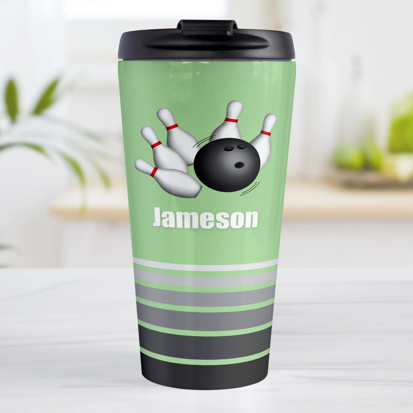 Bowling Ball and Pins Green - Personalized Bowling Travel Mug (15oz, stainless steel insulated) at Amy's Coffee Mugs. A travel mug designed with an illustration of a bowling ball striking bowling pins over a green background color that wraps around the travel mug. Along the bottom of the mug are gray stripes in varying shades creating a dynamic look. Your custom name is printed in white below the bowling ball and pins.