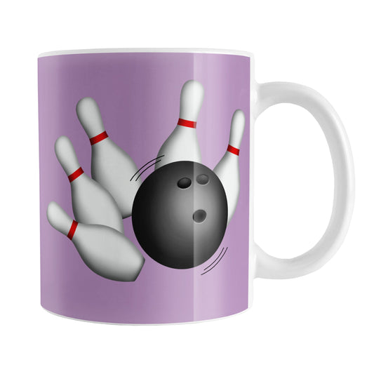 Bowling Ball and Pins Purple Bowling Mug (11oz) at Amy's Coffee Mugs. A ceramic coffee mug designed with an illustration of a bowling ball striking bowling pins on both sides of the mug over a purple background color that wraps around the mug up to the handle.