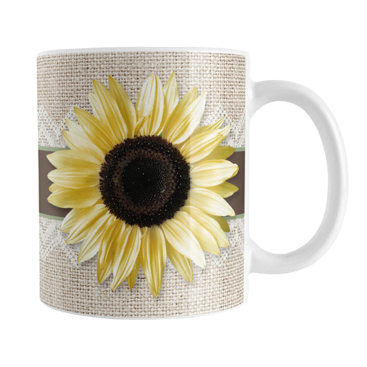 Burlap and Lace Brown Sage Sunflower Mug (11oz) at Amy's Coffee Mugs. A ceramic coffee mug designed with a yellow sunlfower on both sides of the mug over a brown and sage ribbon illustration wrapping around a burlap and lace background that wraps around the mug up to the handle.