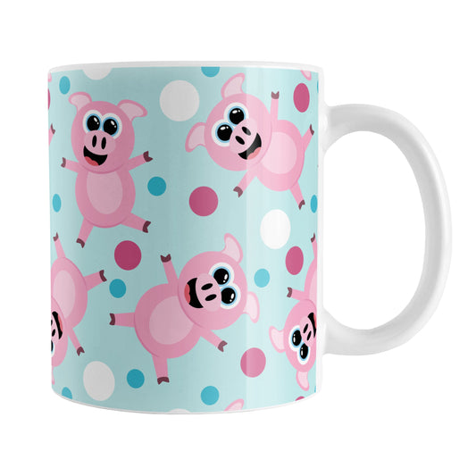Cute Cartoon Pink Pig Blue Mug (11oz) at Amy's Coffee Mugs. A ceramic coffee mug designed with a pattern of cute and happy pink cartoon pigs with fuchsia pink, white, and blue dots over a light blue background that wraps around the mug up to the handle.