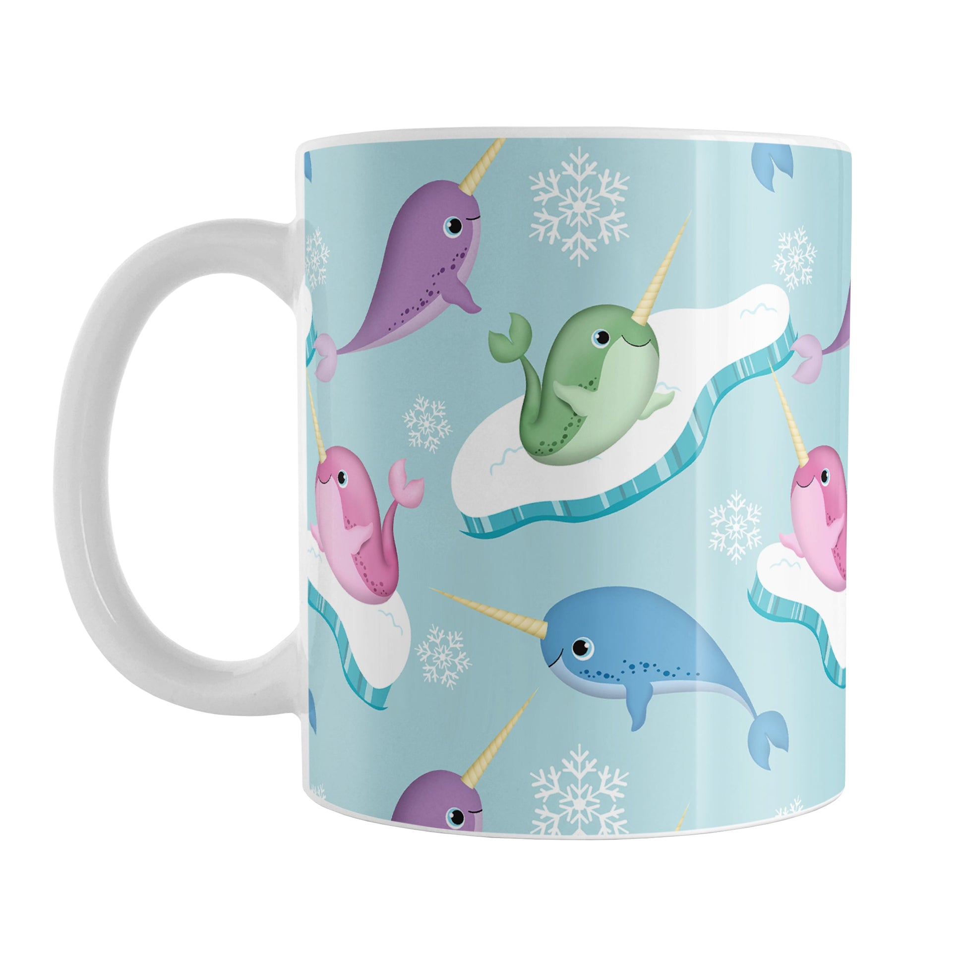 Colorful Arctic Narwhal Pattern Mug (11oz) at Amy's Coffee Mugs. A ceramic coffee mug designed pink, purple, blue, and green narwhals with icebergs and snowflakes over a light blue colored background that wraps around the mug up to the handle.