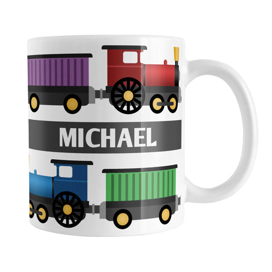 Colorful Locomotive - Personalized Train Mug (11oz) at Amy's Coffee Mugs. A ceramic coffee mug  designed with a colorful locomotive illustration with two sets of engines and box cars in red, green, blue, and purple on both sides of the mug. Your name is personalized in white over a gray stripe that extends across the middle between the trains.