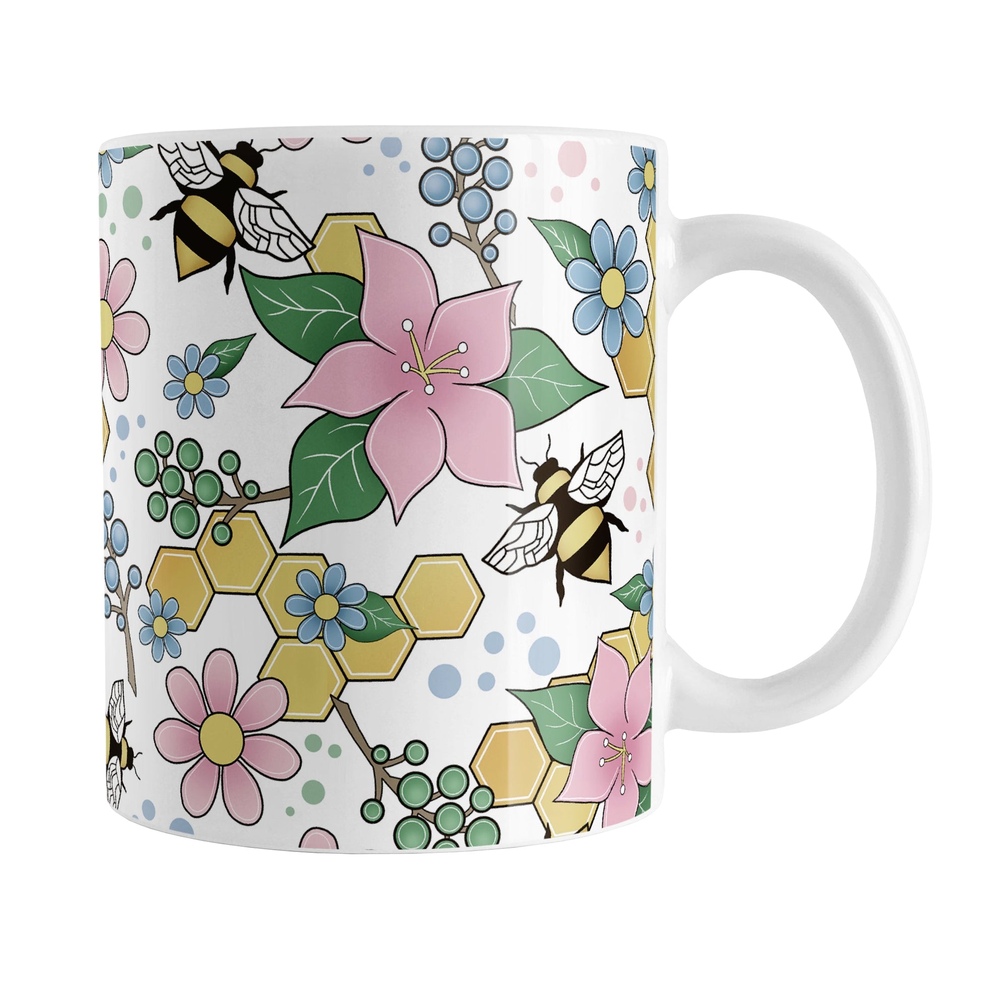 Colorful Pink Floral Bee Pattern Mug (11oz) at Amy's Coffee Mugs. A ceramic coffee mug designed with pink, blue, and green flowers and leaves with bees and golden yellow honeycomb pieces in a pattern that wraps around the mug up to the handle.