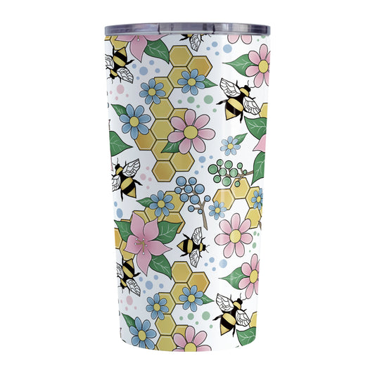 Colorful Pink Floral Bee Pattern Tumbler Cup (20oz, stainless steel insulated) at Amy's Coffee Mugs. A tumbler cup designed with pink, blue, and green flowers and leaves with bees and golden yellow honeycomb pieces in a pattern that wraps around the cup.