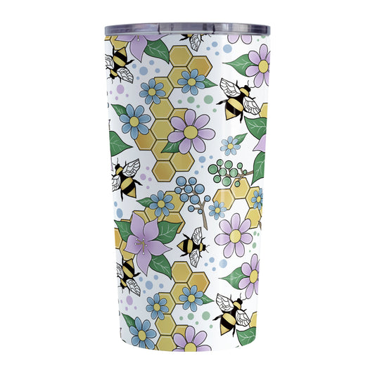 Colorful Purple Floral Bee Pattern Tumbler Cup (20oz, stainless steel insulated) at Amy's Coffee Mugs. A tumbler cup designed with purple, blue, and green flowers and leaves with bees and golden yellow honeycomb pieces in a pattern that wraps around the cup.