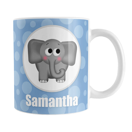 Personalized Cute Elephant Bubbly Blue Mug (11oz) at Amy's Coffee Mugs. A ceramic coffee mug designed with an adorable and affectionate gray elephant in a white circle outlined in gray on both sides of the mug over a blue bubbly background that wraps around the mug up to the handle. Your name is personalized in white below the cute elephant.