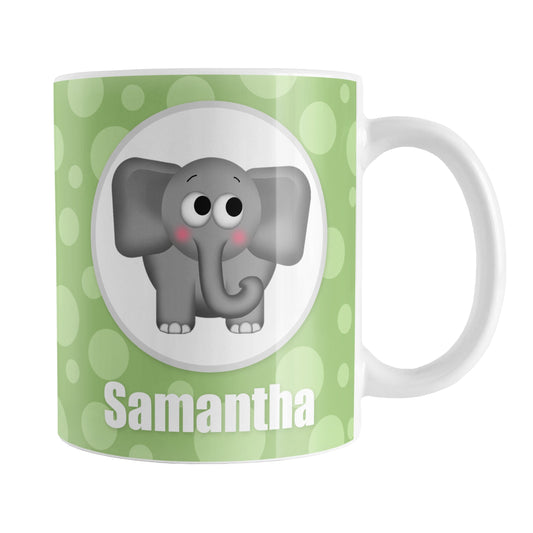 Personalized Cute Elephant Bubbly Green Mug (11oz) at Amy's Coffee Mugs. A ceramic coffee mug designed with an adorable and affectionate gray elephant in a white circle outlined in gray on both sides of the mug over a green bubbly background that wraps around the mug up to the handle. Your name is personalized in white below the cute elephant.