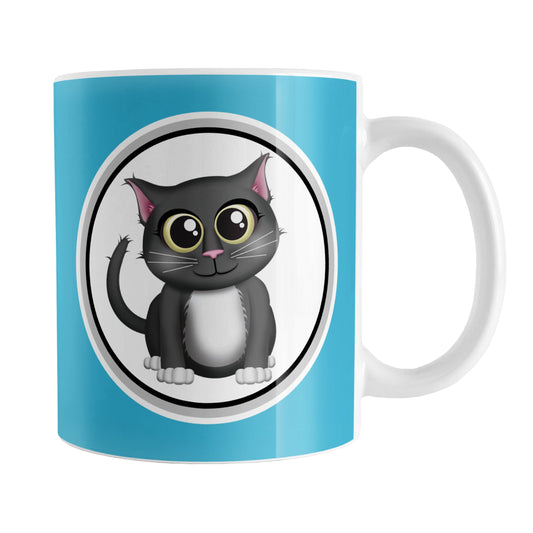Cute Gray Cat Blue Mug (11oz) at Amy's Coffee Mugs. A ceramic coffee mug designed with an adorable gray cat in a white circle outlined in black and gray on both sides of the mug over a blue background color that wraps around the mug up to the handle.