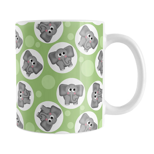 Cute Green Elephant Pattern Mug (11oz) at Amy's Coffee Mugs. A ceramic coffee mug designed with cute and affectionate gray elephants in white circles scattered over a green background color in a pattern that wraps around the mug up to the handle.