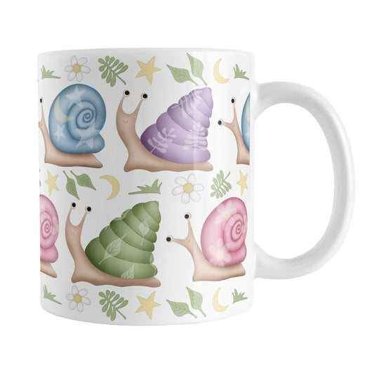 Cute Spring Summer Snails Pattern Mug (11oz) at Amy's Coffee Mugs. A cute snail mug with a whimsical pattern of snails with happy faces in two rows around the mug with pink, purple, blue, and green shells floral and stars watermarks, with foliage, moons, and stars between the rows.