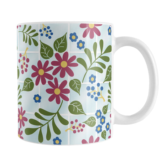 Flowers in the Greenhouse Mug (11oz) at Amy's Coffee Mugs. A ceramic coffee mug designed with a beautiful simple floral pattern with burgundy, blue, and green flowers and leaves over light blue nursery or greenhouse glass windows background design that wraps around the mug up to the handle.