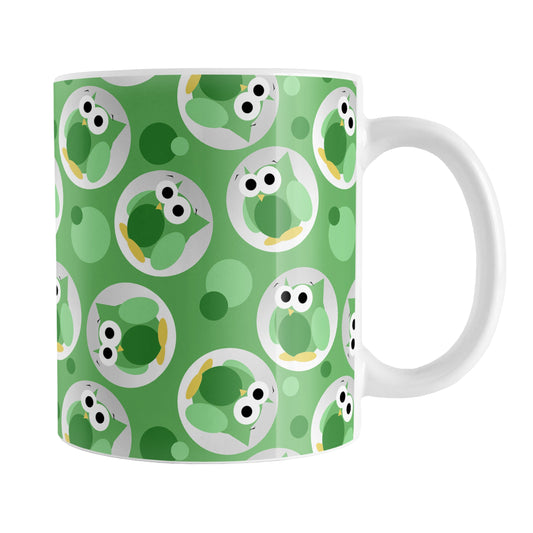 Funny Cute Green Owl Pattern Mug (11oz) at Amy's Coffee Mugs. A ceramic coffee mug designed with a pattern of funny and cute green owls in a light gray circles scattered over a green background color that wraps around the mug.